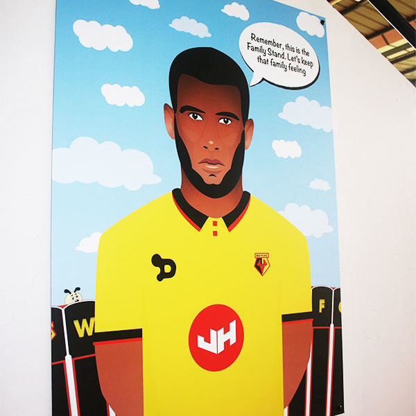Printed illustration of Etienne Capoue, displayed at Vicarage Road Stadium.