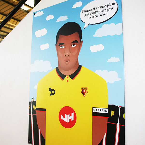 Illustration print of Troy Deeney, displayed in the Family Stand at Vicarage Road Stadium.