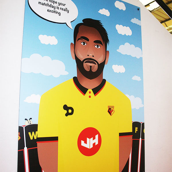 Roberto Pereyra illustration print, displayed in the Family Stand at Vicarage Road Stadium.